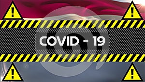 Animation of the word Covid-19 written on yellow and black tape over a flag of Holland in the backgr