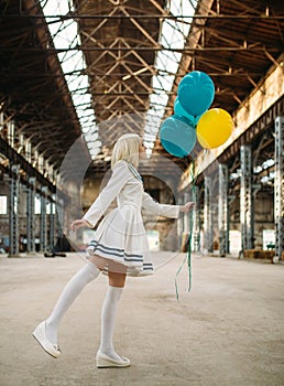 Anime style girl poses with colorful air balloons