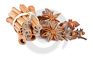 Anise, cinammon and carnation isolated on white