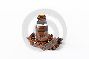 natural cosmetics concept, composition of glass bottles with oil and anise on a white background