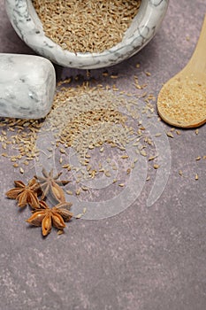 aniseed spice (Pimpinella anisum) in a white marble mortar