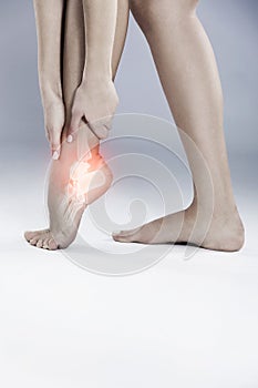 Ankle, pain and emergency injury in foot with inflammation from arthritis or osteoporosis in studio. Medical, trauma and