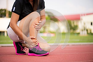 Ankle sprained. Young woman suffering from an ankle injury