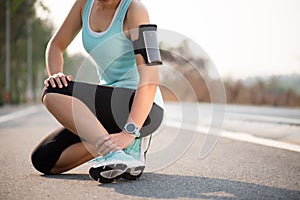 Ankle sprained. Young woman suffering from an ankle injury while exercising and running. Healthcare and sport concept