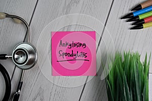 Ankylosing Spondylitis text on sticky notes with office desk. Healthcare/Medical concept