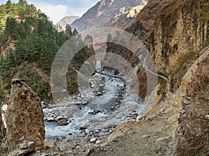 Annapurna Circuit Track- view of the river and Kali Gandaki canyon, on the background Tukuche Peak