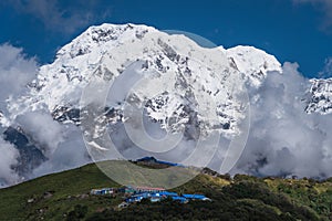 Annapurna south mountain peak behind Badal Danda village in Mardi Himal trekking route in Pokhara, Himalaya mountains range in