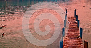 annecy france, pier near the lake of annecy at sunset, called as the venice of the alps, historic city cultural tourism