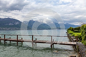 Annecy lake in French Alps in cloudy day.