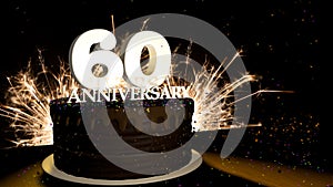 Anniversary 60 greeting card. Chocolate cake decorated with colored dragees with white numbers on a wooden table with fireworks in