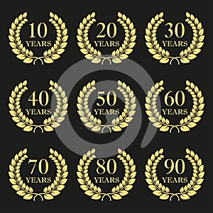 Anniversary laurel wreath icon set. Golden anniversary symbols isolated on black background. 10,20,30,40,50,60,70,80,90 years.