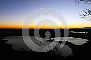 Annone lake at sunset from monte Barro during a clear sky autumn night