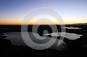 Annone lake at sunset from monte Barro during a clear sky autumn night