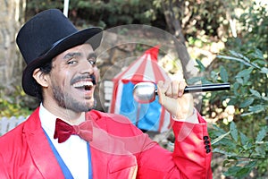 Announcer holding microphone in the circus