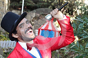 Announcer holding microphone in the circus