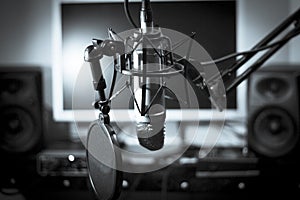 Announcer microphone on recording studio background
