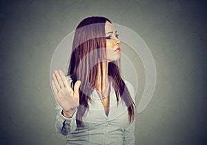 Annoyed angry woman giving talk to hand gesture