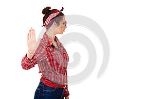 Annoyed angry woman giving talk to hand gesture with palm outward