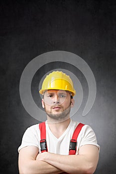 Annoyed construction worker with his arms crossed