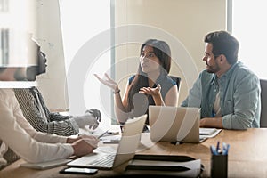 Annoyed diverse employees arguing at briefing, discussing contract terms