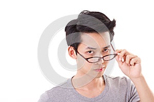 Annoyed genius nerd man looking at you, hand holding eyeglasse