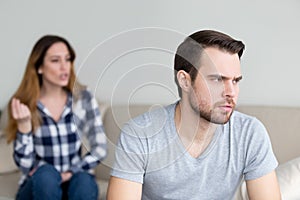 Annoyed husband tired of wife lecturing and arguing