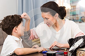 Annoyed mother discussing with son