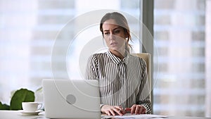 Annoyed stressed businesswoman mad about computer problem leaving office workplace