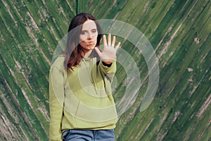 Annoyed Woman Making Stop Hand Gesture photo