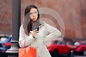Annoyed Woman with Smartphone and Shopping Bag