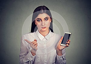 Annoyed woman upset with smartphone