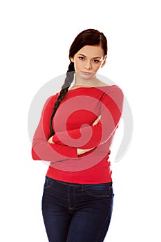 Annoyed young woman with arms crossed