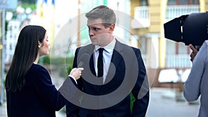 Annoying journalist asking rich oligarch provocative question, yellow press photo