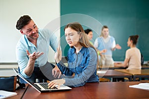 Annoying man student trying to talk with woman