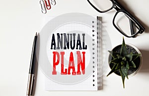 ANNUAL PLAN Conceptual background with calculator and papers charts