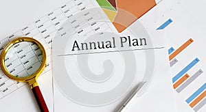 ANNUAL PLAN written on paper with office tools