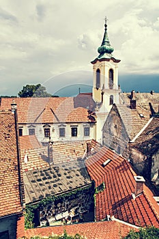 Annunciation church and red roofs of old houses, Szentendre, photo filter