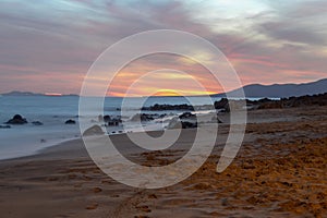 Sunset on the beach where you can see a beautiful landscape of a Lanzarote beach in Spain photo