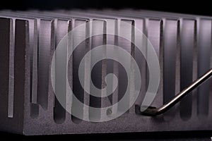 Anodized aluminum coolers isolated on black background. Alu heat sinks for cooling of electronic components as chipsets photo