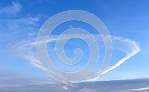 Anomalous cloud in the form of a ring in the blue sky