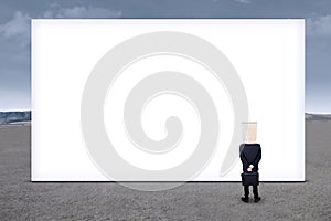 Anonymous businessman and empty billboard 1