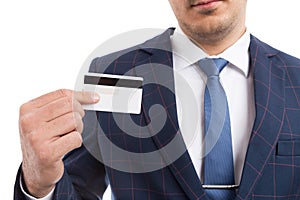 Anonymous businessman holding empty credit card