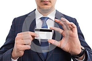 Anonymous businessman holding empty credit card