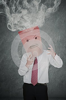 Anonymous businessman with smoke over his head