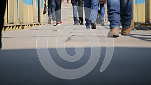 Anonymous crowd of people walking on city street commuting home after work. urban business lifestyle background