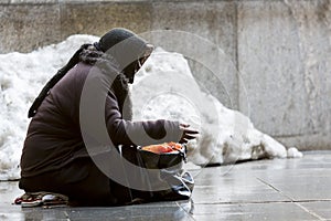 Anonymous female beggar photo