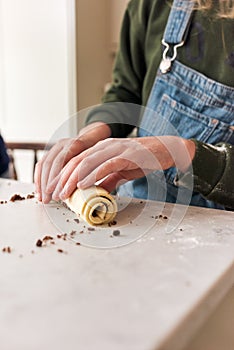 Anonymous girl baking with tablet computer