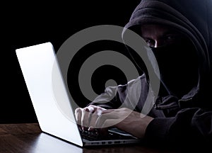 Anonymous hacker in the dark