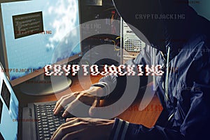 Anonymous hacker without a face is trying to steal cryptocurrency using a computer. Fraud and deception at Cryptojacking