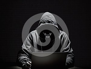Anonymous hacker without face typing computer laptop. Concept of hacking cybersecurity, cybercrime, cyberattack, etc